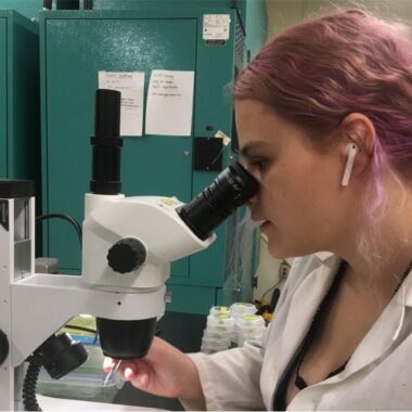 Grace Bowe-MacLean doing microscopy work