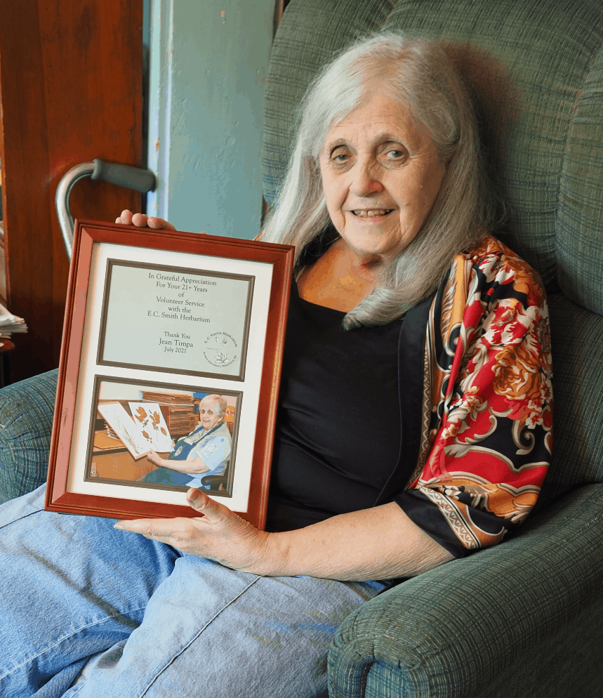 a photo of Jean holding her plaque